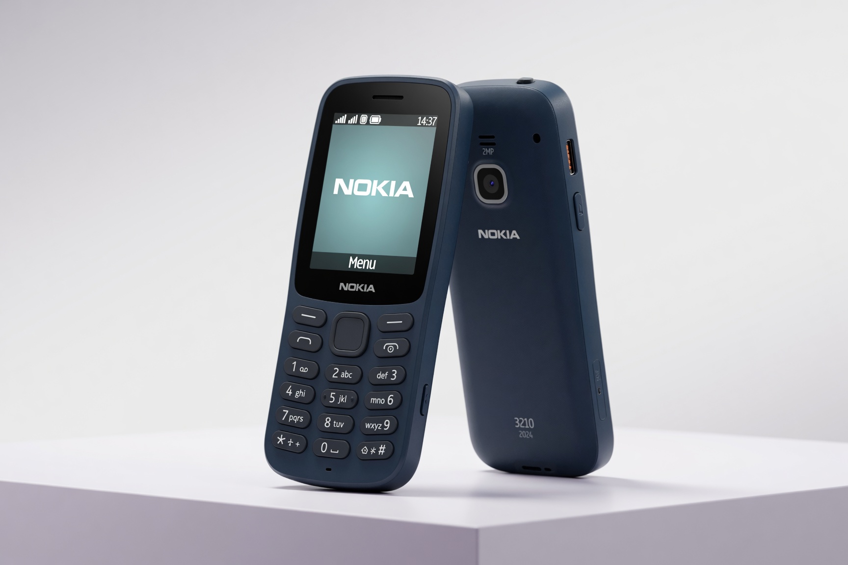 Nokia 3210 2024 candy-bar feature phone front and back view — navy blue with 3210 2024 marking